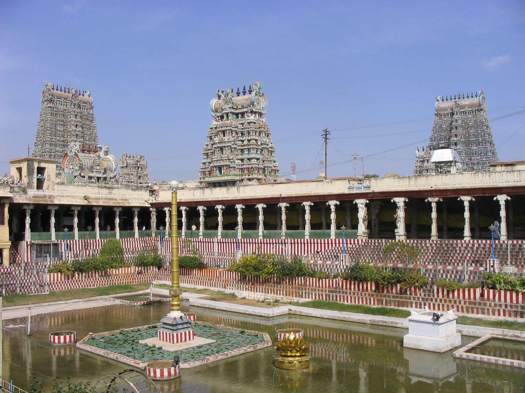 Meenakshi Amman Temple in Madurai highlighting car loan services in Madurai district for new cars, used car financing, refinancing, and low EMI plans.