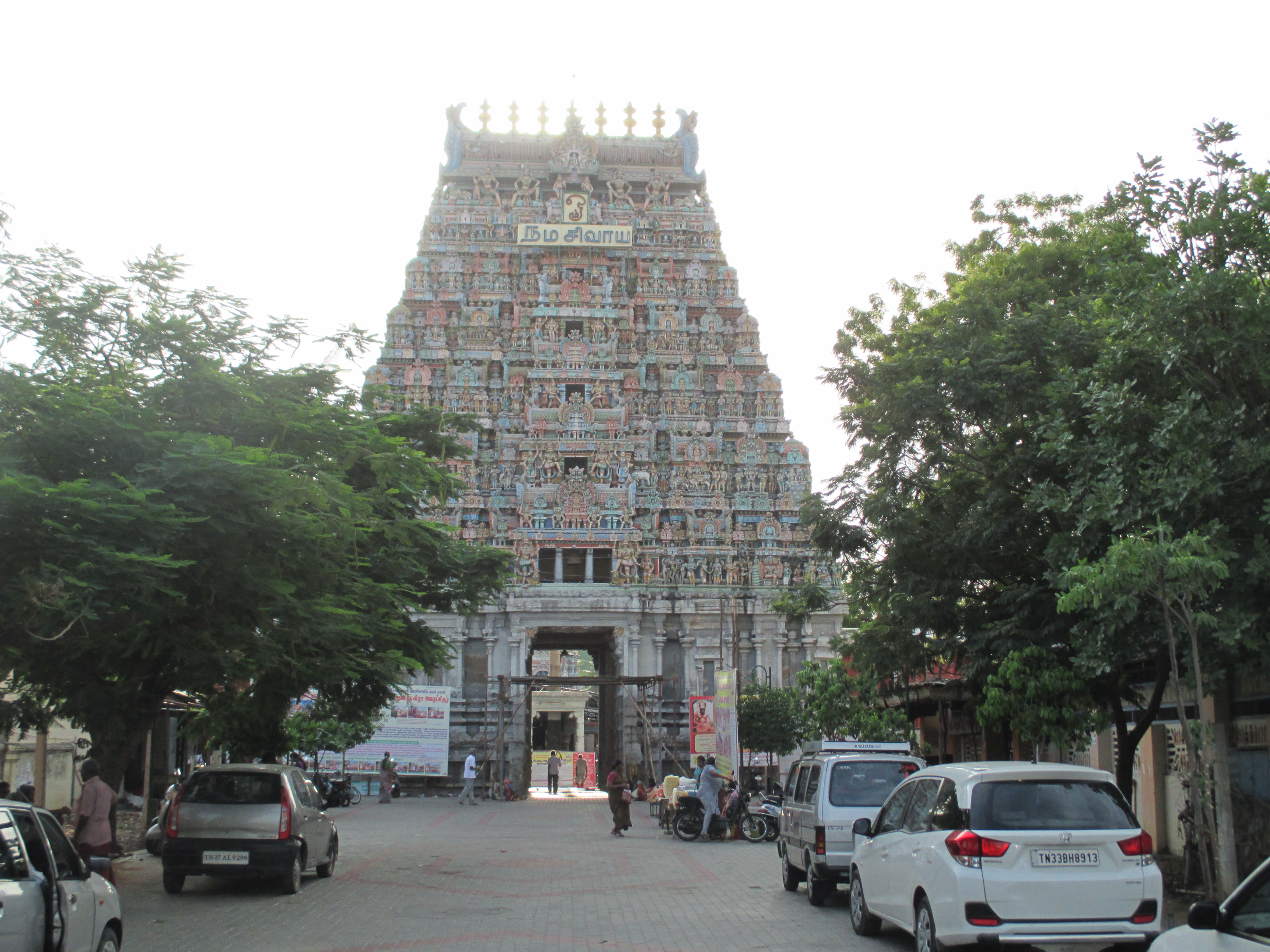 Karur temple tower image showcasing car loan services in Karur district including low EMI car loans, used car financing, and fast approval support.